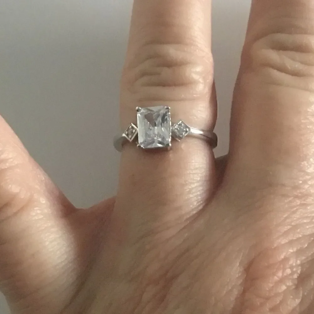 1.8 Ct. Emerald Cut Simulated Diamond Bridal Ring